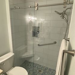 Bonito Tile - Master. Tub removed and glass barn doors installed.