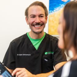 Dermacare Encinitas at Schoemann Plastic Surgery - Dr. Schoemann interacting with patients, prioritizing their specific goals.