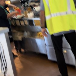 McDonald's - The lady in the green is the store manager you can see her unloading our used food into a drive thru guests bag