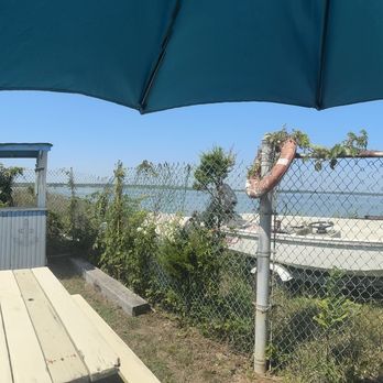 Multi Aquaculture Systems - Tables with Bay facing view - Seafood Near Me - Amagansett, New York Multi Aquaculture Systems - Tables with Bay facing view - Seafood Near Me - Amagansett, New York