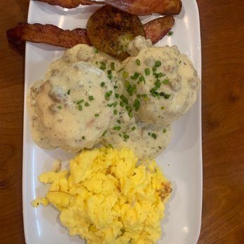 Ruby Slipper Orange Beach - Biscuits and sausage gravy, eggs, bacon, and a fried green tomato - Cafes Near Me - Orange Beach, Alabama