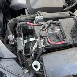 MCMC Auto - Smashed pumps from the collision and broken pieces of car left all inside of the hood