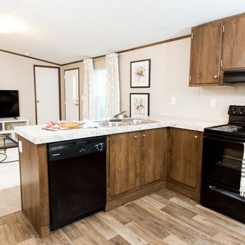 Economy Housing - the kitchen and living room of a mobile home - General Contractors Near Me - Goodrich, Texas Economy Housing - the kitchen and living room of a mobile home - General Contractors Near Me - Goodrich, Texas
