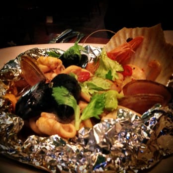 Jamie's Italian - Fish Baked in a Bag with clams, mussels, fennel, chilli, anchovies & Sicilian cracked wheat - Italian Near Me - Sydney, NSW Jamie's Italian - Fish Baked in a Bag with clams, mussels, fennel, chilli, anchovies & Sicilian cracked wheat - Italian Near Me - Sydney, NSW
