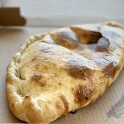 Beautiful cook on Pop's Pepperoni Calzone with black olives (86 ricotta)
