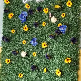 a cake made to look like a field of flowers a cake made to look like a field of flowers