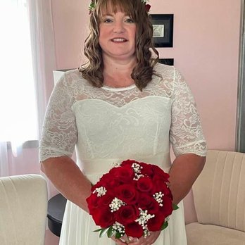 Evergreen Florist - This is me on my wedding day with the beautiful rose bouquet and floral headband that were made by Evergreen Florist. - Florists Near Me - Spokane, Washington