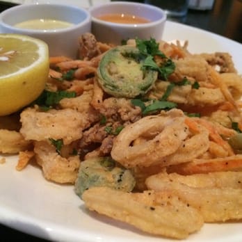 J Gilbert's - Calimari with tempura carrot strings, jalapeños, and two dipping sauces - a spicy white sauce, mild vinegar dip, fresh lemon. - Steakhouses Near Me - McLean, Virginia