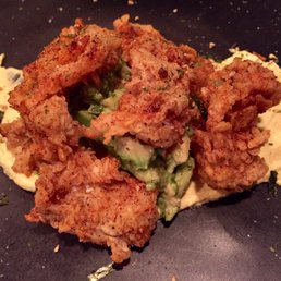 Flash fried oysters with avocado salad and deviled egg sauce