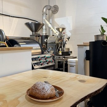 Honey Dirt Coffee - Chocolate Croissant on the table near the roaster - Coffee Roasteries Near Me - Ferndale, Michigan Honey Dirt Coffee - Chocolate Croissant on the table near the roaster - Coffee Roasteries Near Me - Ferndale, Michigan