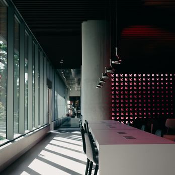 Idlewild Coffee - a row of chairs facing a window - Coffee & Tea Near Me - Austin, Texas