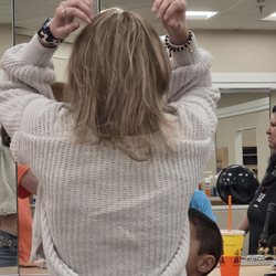 Seguin Beauty School - New Braunfels - This is much better. They put back in some of her brown and toned snd corrected the yellow/orange.