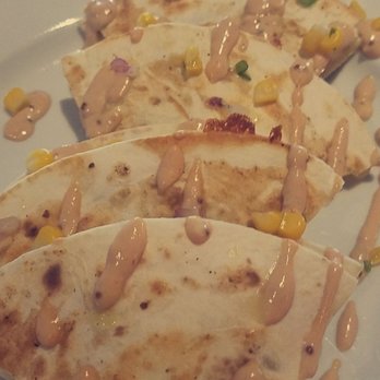 Sweet Waters on the River - Crispy Pork Belly Quesadilla... pork belly roasted with pepper relish, and Tillamock jack cheese - American Near Me - Eugene, Oregon