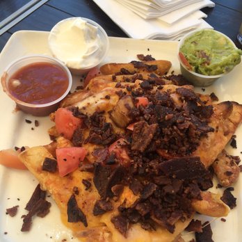 Gallagher's Pub & Grill - Irish nachos, service was terrible, these fries sat out for a while before server brought them out, She was chatting up the table next to us - Pubs Near Me - Long Beach, California Gallagher's Pub & Grill - Irish nachos, service was terrible, these fries sat out for a while before server brought them out, She was chatting up the table next to us - Pubs Near Me - Long Beach, California