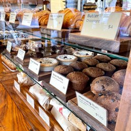 Pastry case with Butter Croissant, Chocolate Croissant, bran muffins, morning buns, and more. Pastry case with Butter Croissant, Chocolate Croissant, bran muffins, morning buns, and more.