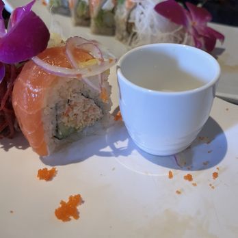Misaki Sushi & Grill - For reference - on piece of the sunshine roll next to the saki cup. Just too large to fully enjoy. - Sushi Bars Near Me - La Quinta, California Misaki Sushi & Grill - For reference - on piece of the sunshine roll next to the saki cup. Just too large to fully enjoy. - Sushi Bars Near Me - La Quinta, California