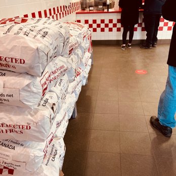 Five Guys - a large stack of bags of food - Fast Food Near Me - Vaughan, Ontario