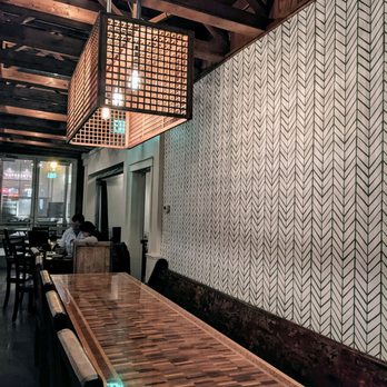 Stella's - a long wooden table in a restaurant - New American Near Me - De Pere, Wisconsin