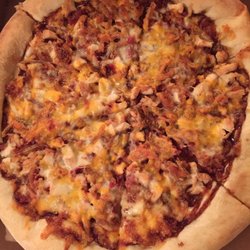 FRANCO'S PIZZERIA - Chicken Cowboy pizza - fried onions and bacon perfectly surrounded by tangy barbecue sauce deliver a tasty surprise you may not expect.