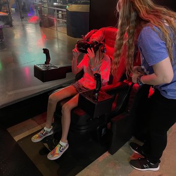 Two Bit Circus - Buckling up for one of the VR games. - Arcades Near Me - Santa Monica, California