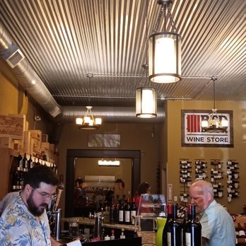 Red Door Wine Store - two men at a counter - Wine Bars Near Me - Lee's Summit, Missouri Red Door Wine Store - two men at a counter - Wine Bars Near Me - Lee's Summit, Missouri