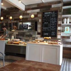 Industry - Counter and menu with salads, chicken, salmon and sweet treats!