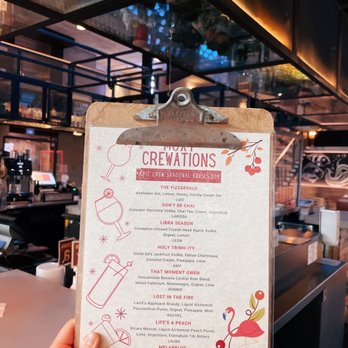 Bar Moxy - a hand holding a menu - Cocktail Bars Near Me - San Diego, California