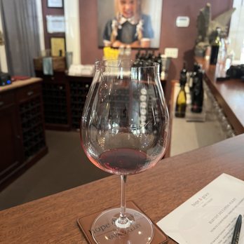 Hope & Grace Wines - a glass of wine on a table - Wineries Near Me - Yountville, California Hope & Grace Wines - a glass of wine on a table - Wineries Near Me - Yountville, California