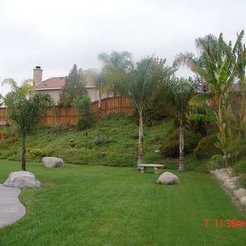 Erick's Landscape - a backyard with a pool and palm trees - Landscaping Near Me - San Bernardino, California Erick's Landscape - a backyard with a pool and palm trees - Landscaping Near Me - San Bernardino, California