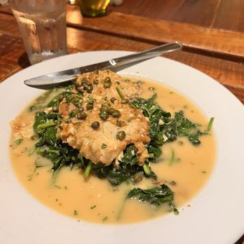 Osteria Cicchetti - Veal piccata on a bed of Sautéed spinach with Garlic - Italian Near Me - Wilmington, North Carolina