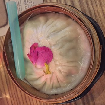 Dumpling Time - The giant xlb with a straw. Very hot so let the insides cool after poking a hole. Eat over plate bc wooden container has holes. - Dim Sum Near Me - San Francisco, California