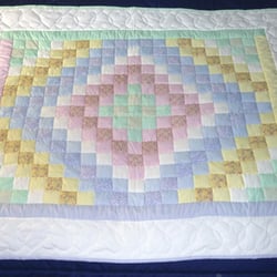 Amish Spirit - We carry adorable Amish Baby Quilt - this pattern is the traditional Trip Around the World (also called Sunshine and Shadows).