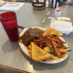 Meatloaf, garlic toast, cooked vegetables. A customer can order side dishes.