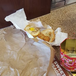  a hot dog and a can of soda on a counter