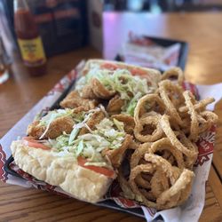 Uncle T's Oyster Bar - Fish poboy with onion rings.