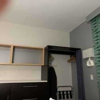 Home2 Suites by Hilton Florence, SC - Cabinets and closet with ironing board and iron - Hotels Near Me - Florence, South Carolina Home2 Suites by Hilton Florence, SC - Cabinets and closet with ironing board and iron - Hotels Near Me - Florence, South Carolina