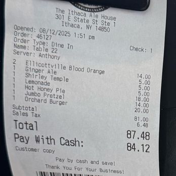 Ithaca Ale House - Bill $5.00 sodas - The receipt from Ithaca Ale House displays details of a dine-in order, including items such as Ellicottville Blood Orange, Ginger Ale, Shirley Temple, Lemonade, Hot Honey Pie, Jumbo Pretzel, and Orchard Burger, with prices and a subtotal. It shows the date, time, server name, and total amount paid, along with payment details and a barcode at the bottom. - New American Near Me - Ithaca, New York