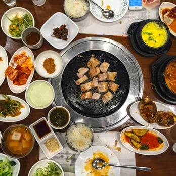 Hahm Ji Bach - pork belly on the grill.
side dishes abound.
chef nick with the photographical pot, boi. - Korean Near Me - Flushing, New York Hahm Ji Bach - pork belly on the grill.
side dishes abound.
chef nick with the photographical pot, boi. - Korean Near Me - Flushing, New York