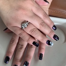 Cat eye gel with ghost nail art. Cat eye gel with ghost nail art.