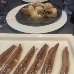 Escargot (top) and anchovies (bottom)