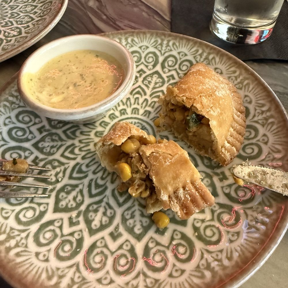 Ila's - Delicious corn & shishito empanada with chimichurri ranch - Comfort Food Near Me - Chicago, Illinois Ila's - Delicious corn & shishito empanada with chimichurri ranch - Comfort Food Near Me - Chicago, Illinois