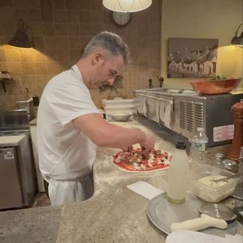 Pizzeria Giove - Giorgio making a Margherita pizza with olives. I only wish I wasn't so full or would have ordered this also!! - Italian Near Me - Staten Island, New York Pizzeria Giove - Giorgio making a Margherita pizza with olives. I only wish I wasn't so full or would have ordered this also!! - Italian Near Me - Staten Island, New York