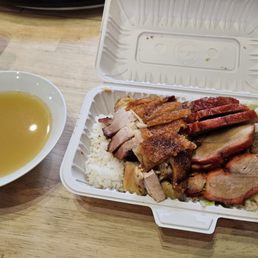 Rice box with roasted pork and bbq pork, daily soup Rice box with roasted pork and bbq pork, daily soup