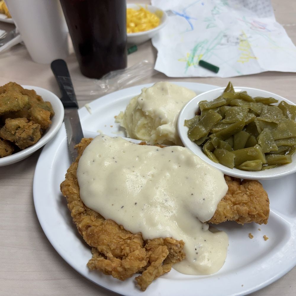 Chicken fried chicken with fried okra, green beans and mashed potatoes. Chicken fried chicken with fried okra, green beans and mashed potatoes.
