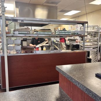 Marco's Pizza - Inside making and cutting pizza - Pizza Near Me - Omaha, Nebraska Marco's Pizza - Inside making and cutting pizza - Pizza Near Me - Omaha, Nebraska