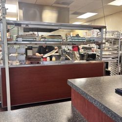 Marco's Pizza - Inside making and cutting pizza