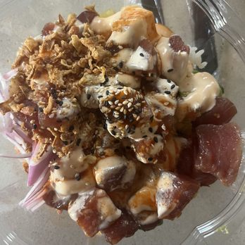 Poke Bros. - Build Your Own Poke Bowl (marinated tuna) - A poke bowl featuring marinated tuna, crispy fried onions, sesame seeds, and creamy sauces in a clear plastic container, with visible vegetables and garnishes. - Poke Near Me - Springfield, Pennsylvania