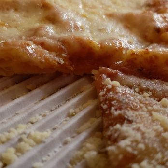 Uncle Tony's - Look at the thin crust, and equally thin layer of cheese in what is supposed to be "extra" cheese. - Italian Near Me - Valley Glen, California Uncle Tony's - Look at the thin crust, and equally thin layer of cheese in what is supposed to be "extra" cheese. - Italian Near Me - Valley Glen, California