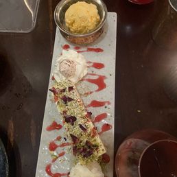 White Chocolate Chai Pistachio cheesecake with mango Ice cream White Chocolate Chai Pistachio cheesecake with mango Ice cream