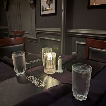 The Peddler Steak House - a glass of water on the table - Steakhouses Near Me - Raleigh, North Carolina